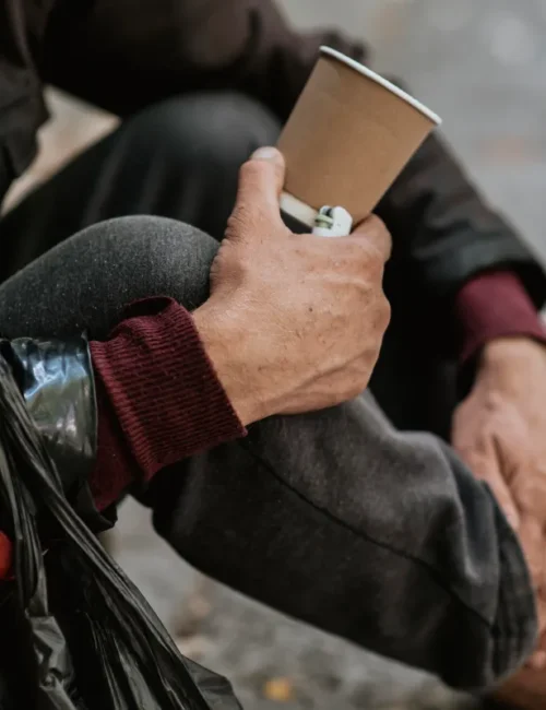 side-view-homeless-man-holding-cup